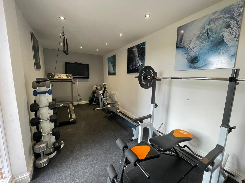 GARAGE (CURRENTLY USED AS HOME GYM)